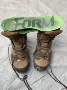 Picture of FORM insoles that have been customized on top of a pair of boots