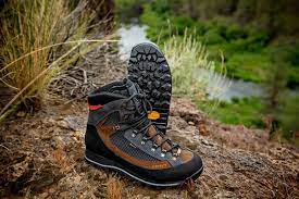 Pait of Crispi SUmmit GTX II boots by grass and water